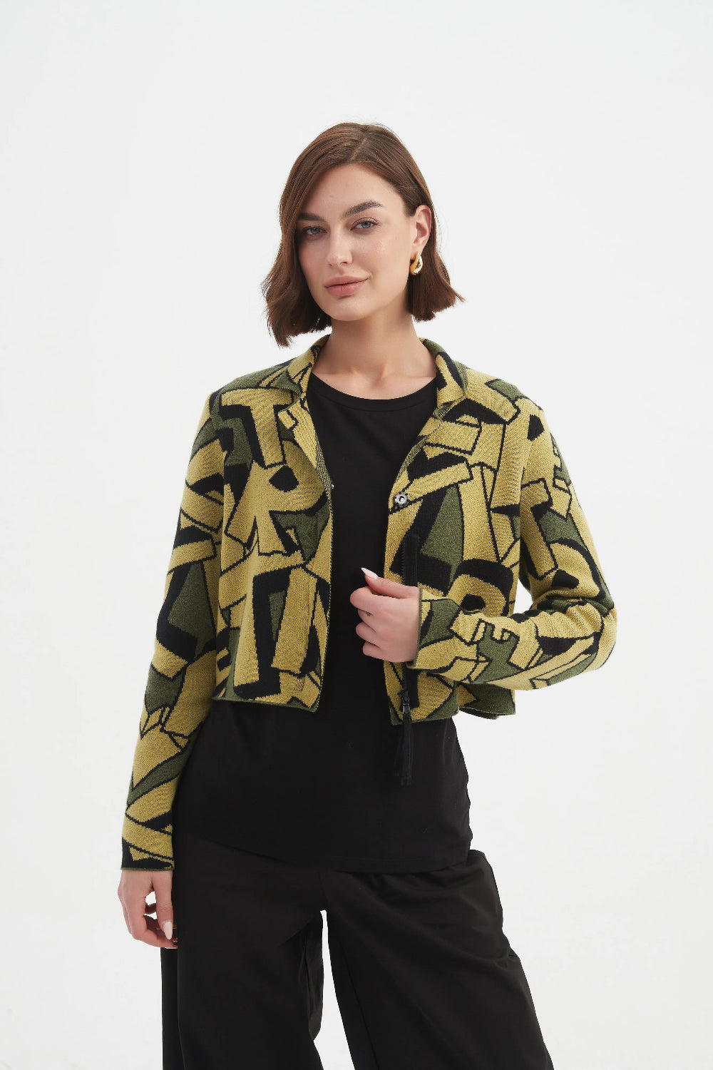 Woman wearing a patterned jacket on a white background
